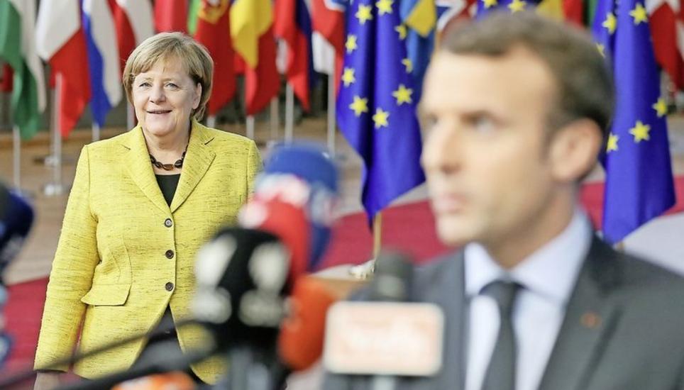 Angela Merkel und Emmanuel Macron bei ihrer Ankunft am EU-Gipfel in Brüssel. Bild: Key
