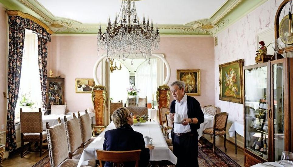 Max Schlumpf, hotelier at Hotel Park Villa, serving coffee to the author. Picture: Selwyn Hoffmann