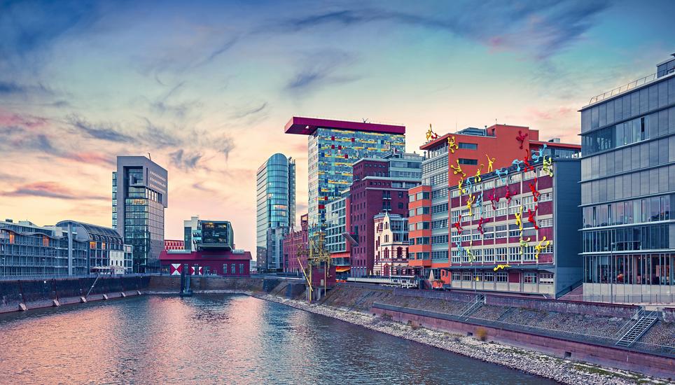 Colorful view of Rhine river at evening in Dusseldorf. Medienhafen in the soft sunset light, Nordrhein-Westfalen, Germany, Europe. Instagram toning. 