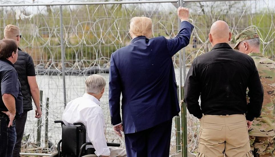 Republican presidential candidate former President Donald Trump gestures to people across the Rio Grande in Mexico at Shelby Park during a visit to the U.S.-Mexico border, Thursday, Feb. 29, 2024, in Eagle Pass, Texas. (AP Photo/Eric Gay)