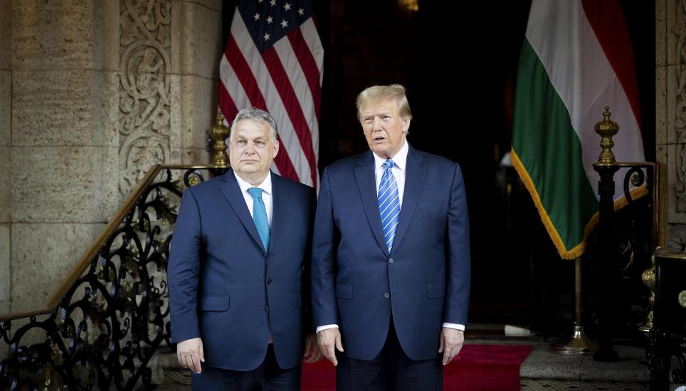 epa11208137 A handout photo made available by the Hungarian Prime Minister's Office shows  
former US President and Republican presidential candidate Donald Trump (R) and Hungarian Prime Minister Viktor Orban posing for photographers before their meeting 