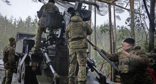 Ukrainian servicemen fires a self-propelled howitzer "Bohdana" towards Russian positions near Bakhmut, Ukraine, Donetsk region, Ukraine, Friday, Jan. 26, 2024. (AP Photo/Efrem Lukatsky)