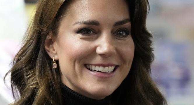 FILE - Kate, Princess of Wales smiles as she speaks to a woman during her visit to Sebby's Corner in north London on Nov. 24, 2023. Charles' illness comes at a awkward time, as his daughter in law, the Princess of Wales, has also had her own health issues