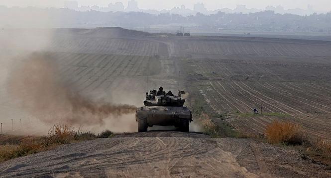 epa11264260 An Israeli army tank moves along the border with Gaza in southern Israel , 07 April 2024. Israel marks six months since the October 07 attacks, as 134 hostages are currently still being held captive in Gaza, according to the Israeli IDF. More 